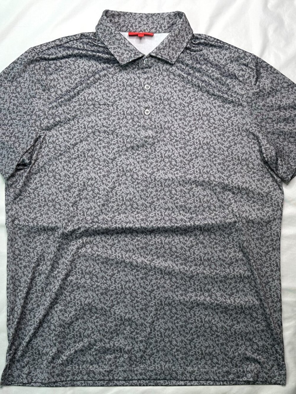 The Redvanly Polo Shirt for men in size Large features a stylish gray camo desig